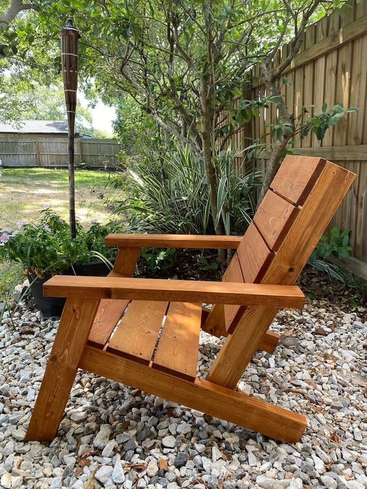 DIY Adirondack chair built from 2x6 lumber on a backyard deck